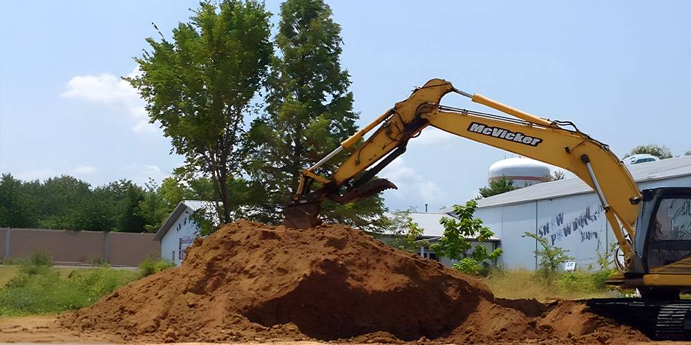 Excavator performing site work